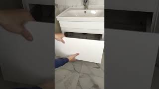 How to pull out the drawer of the washbasin cabinet?