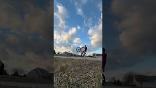 1 hand and 1 foot wheelie