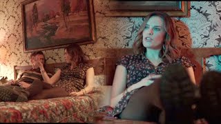 Jessica McNamee reclining on a bed & chair in black pantyhose.  2019 movie I'm Just F##king with You