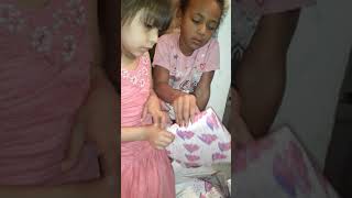 my daughter opening up her presents on her 5th birthday