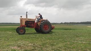 1967 Case 930 and Kuhn 8' disc mower cutting alfalfa