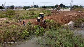 Starting new project showing power dozer working push clean forest and filli stone