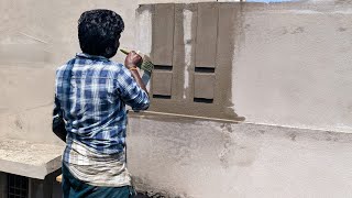 Construction work of plastering front wall border design of house with cement compound | Wall design