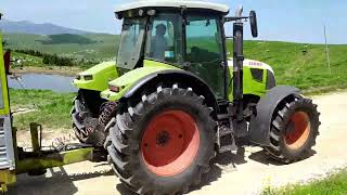 HUGE tractor hauls trailer up on the mountain