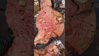 Garlic stuffed prime rib slicing