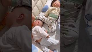 Baby twins sleep opposite heads funny