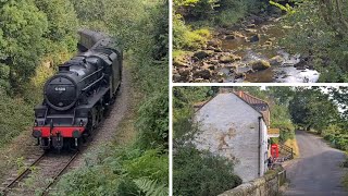 Steam train rattles through idyllic tiny hamlet with characterful pub