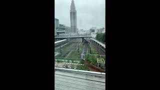 Shinjuku rainy day. Friday afternoons. Trains coming and going