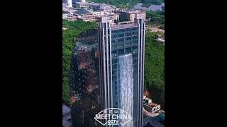 a 108-meter-high man-made waterfall gushing down the side of a skyscraper in Guiyang | 贵州世界最高人造瀑布大楼