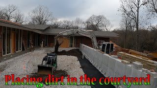 Placing Dirt Inside The Courtyard And Spreading More Clay