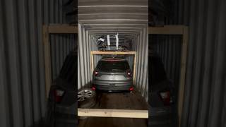 4 vehicles loading 40” container