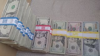 What $1,000 looks like in various denominations (fives, twenties, fifties, hundreds)