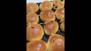 Homemade raisins buns fresh from the oven for breakfast