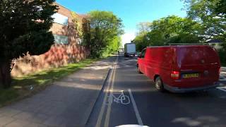 Dangerous swerving close pass near cyclist and pedestrian island