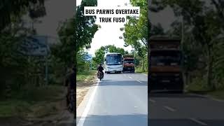 Bus parwis overtake truk fuso