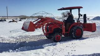 Kubota L3901 with a LA525 Front End Loader Digging Snow (2018)