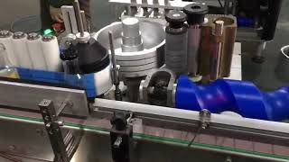 Wet glue labeling machine for small glass bottles