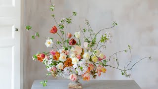 Urn of blossom and tulips