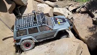 Scx 10 ii rtr xj putting work with my nephews driving. (caution language)