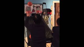 Grandmother versus a boy in basketball shoot out.