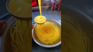 A traditional noodle making technique