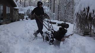 Bready walk behind tractor plowing snow