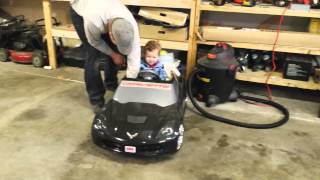 Daxson in his Corvette powerwheels