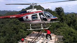 Transporting materials to and from site using heli