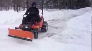 Me plowing snow on my Kubota ZD323 zero turn