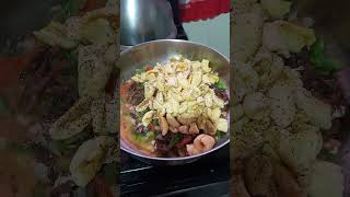 cooking red arein with ackee and fry dumpling for breakfast