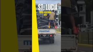 St. Lucia's Wild Ride: Man Clings to Cargo Behind Truck! #wildride #stlucia