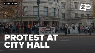 Protesters outside City Hall say both parties failed on economy, health care, and rent