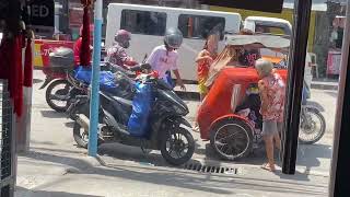 July 20, 2024 | A delivery rider bumps into a tricycle at Trabajo Market.