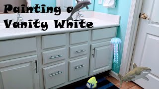 HOW TO PAINT A BATHROOM VANITY CABINET  WHITE  AND INSTALL DRAWER PULLS  EASY TUTORIAL  STEP BY STEP