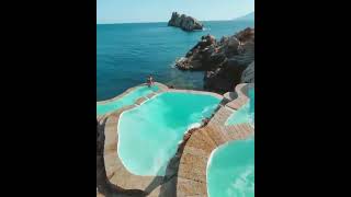 Cliffside pools in Greece 💙 #shorts