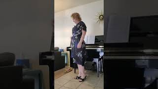 Older woman models dress and high heels