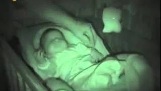 Sleeping baby has robot arms