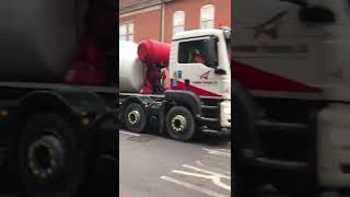 2015 MAN cement mixer truck driving in busy London