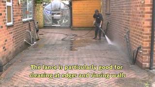 Power-washing a driveway