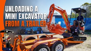 Unloading a Mini Excavator From a Trailer