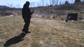 Glock 21 .45 acp with federal hollow point ammunition shooting a water filled jug