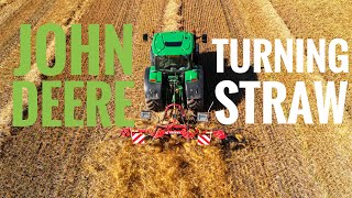 John Deere 6155R tractor turning straw in Lancashire - farming (drone)