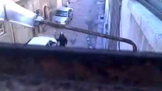 Syrian security forces  in uniform engage and destroy the property of the people on the streets