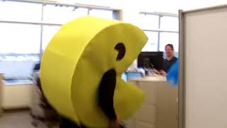 Custom Pac-man costume running through the office