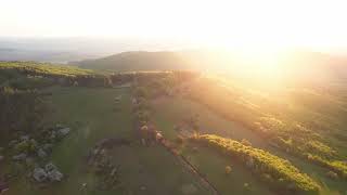 Aerial establishing shot of the sun rising over the lower tatras mountains in slovakia FREE STOCK