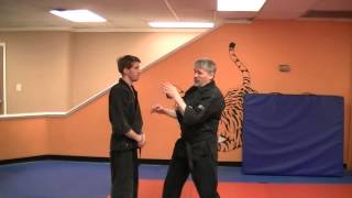 Thrusting Wedge - Kenpo self defense technique for a front two hand choke