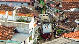 PERSIMPANGAN JALUR GELAP KERETA BARANG MELEWATI GANG RUMAH PANJANG