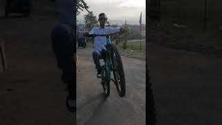 one hand wheelie on mtb