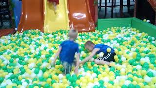 Charles playing in the ball pit