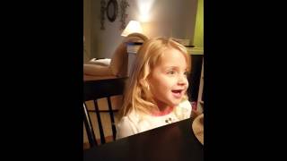 Ava sings "Somewhere Over the Rainbow ".